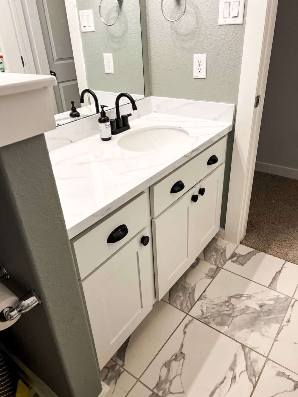 Bathroom counter with faux marble epoxy treatment