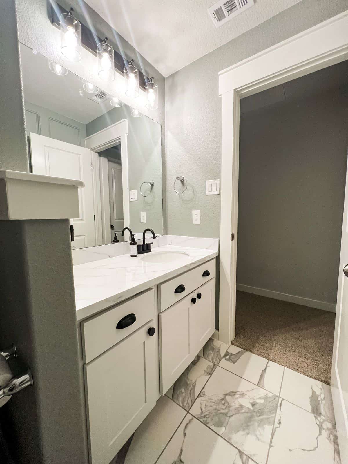 Bathroom vanity with faux marble countertop