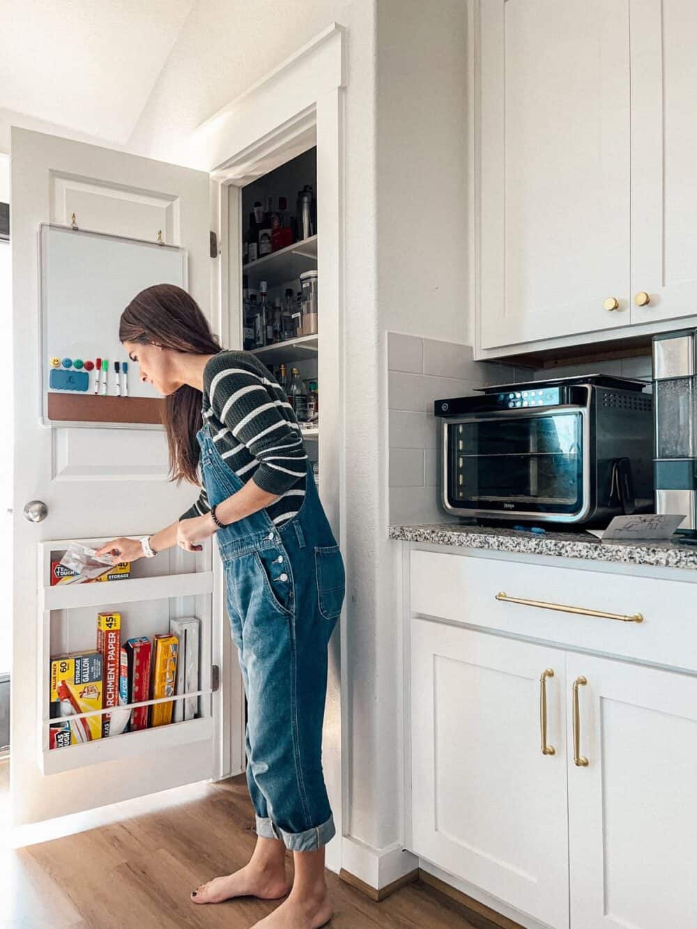 Woman grabbing a ziplock bag from a pantry 