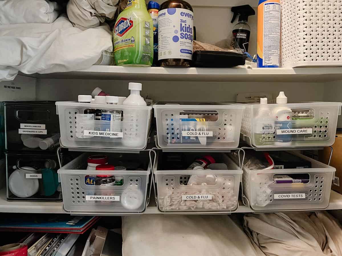 linen closet shelf with organized medicine 