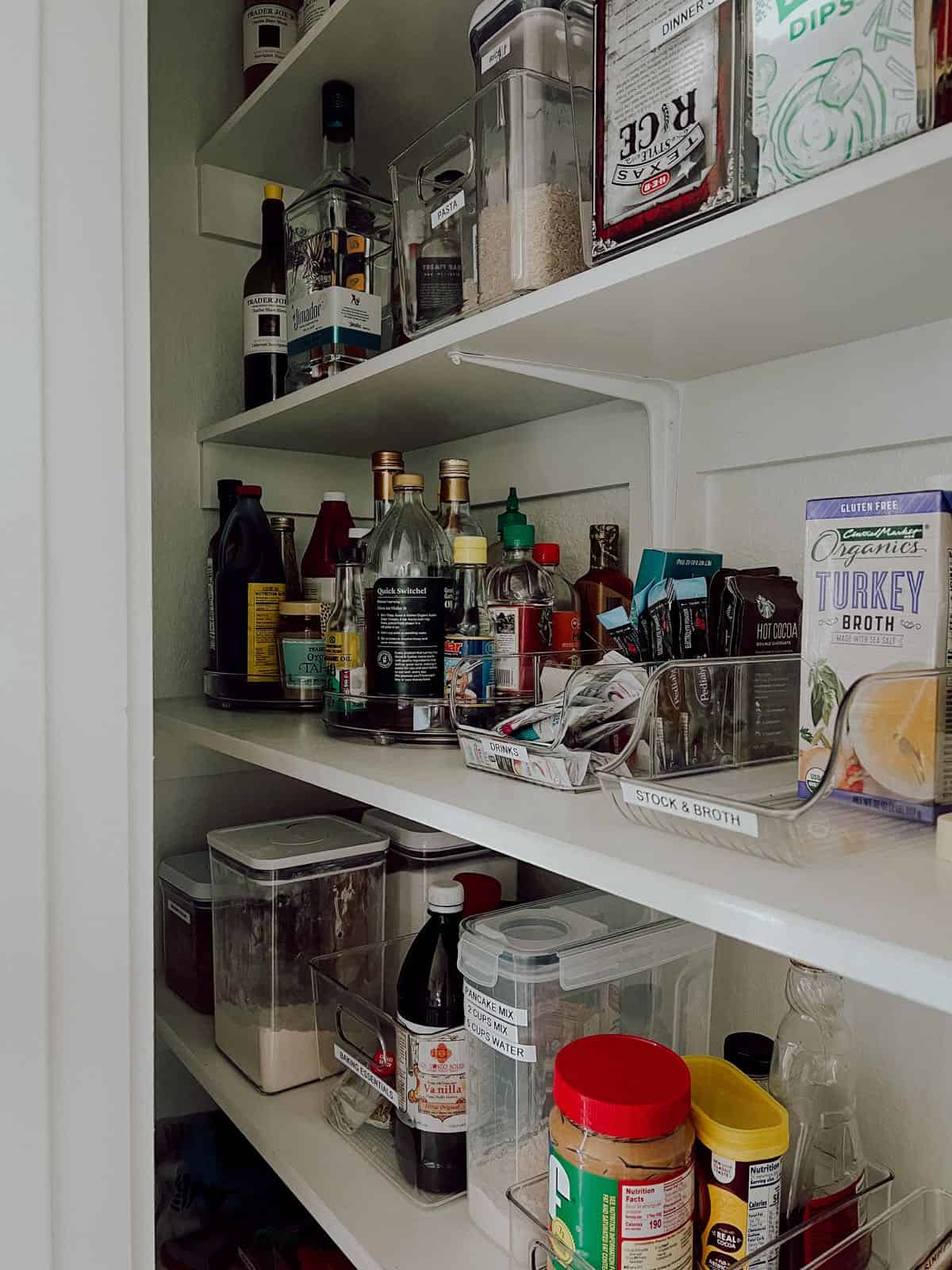 Small pantry with lazy susans in the corner 