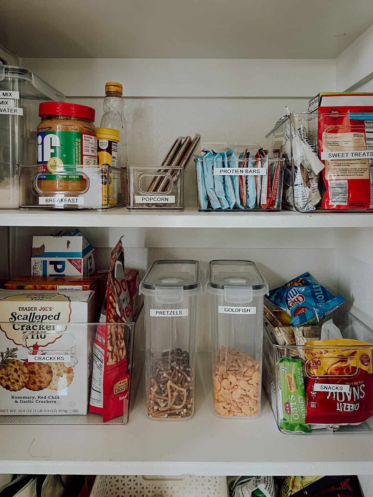 pantry with food decanted into plastic containers 