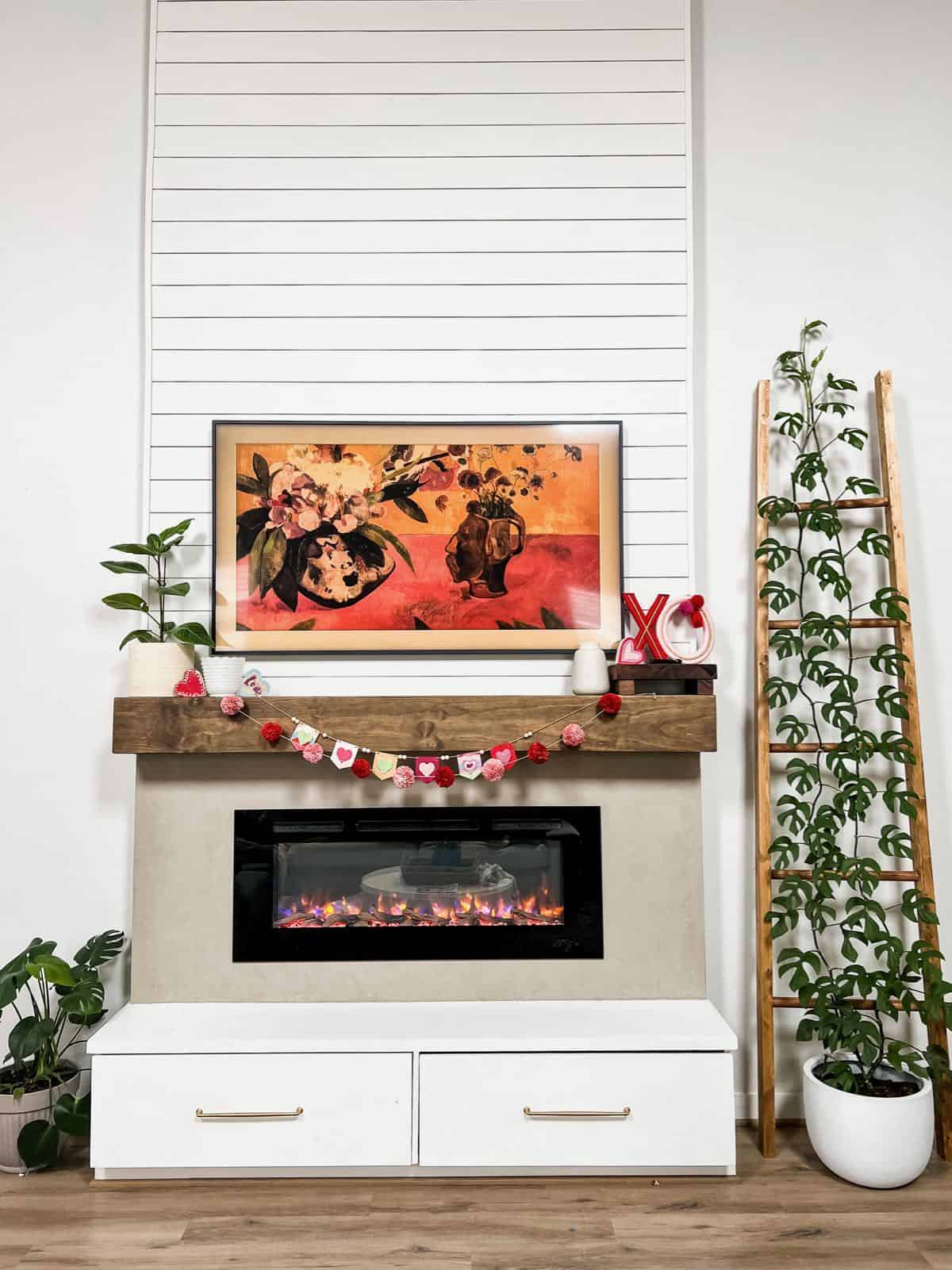Tall fireplace decorated for Valentine's day with DIY decor