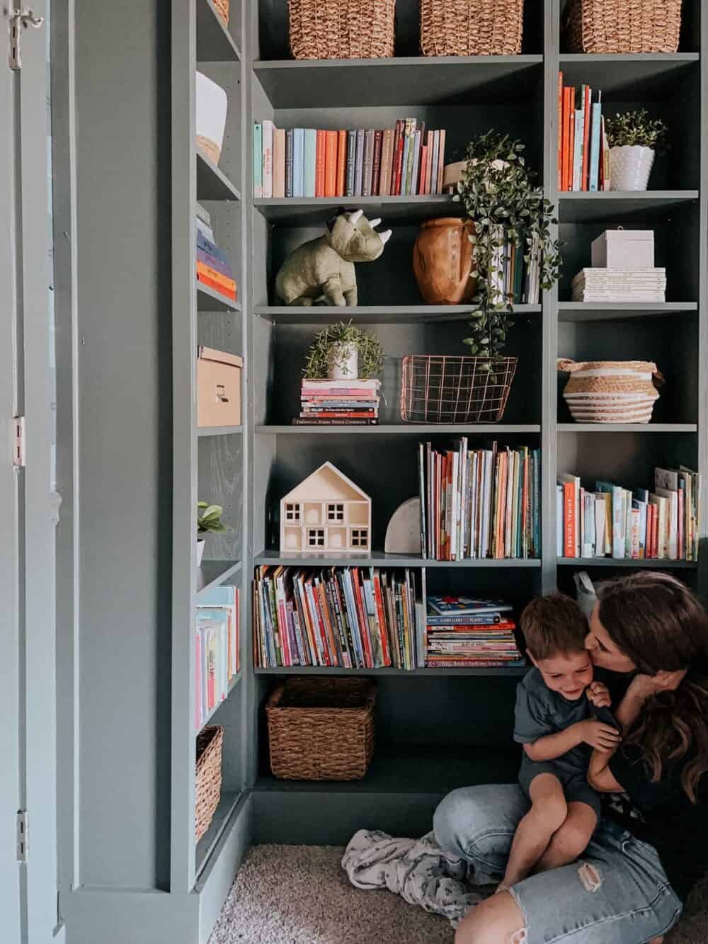 Green bookcases styled with books