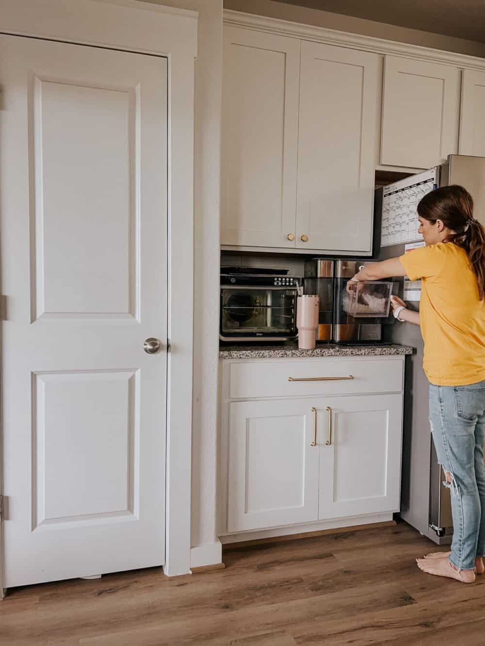 Woman getting ice from a pebble ice machine