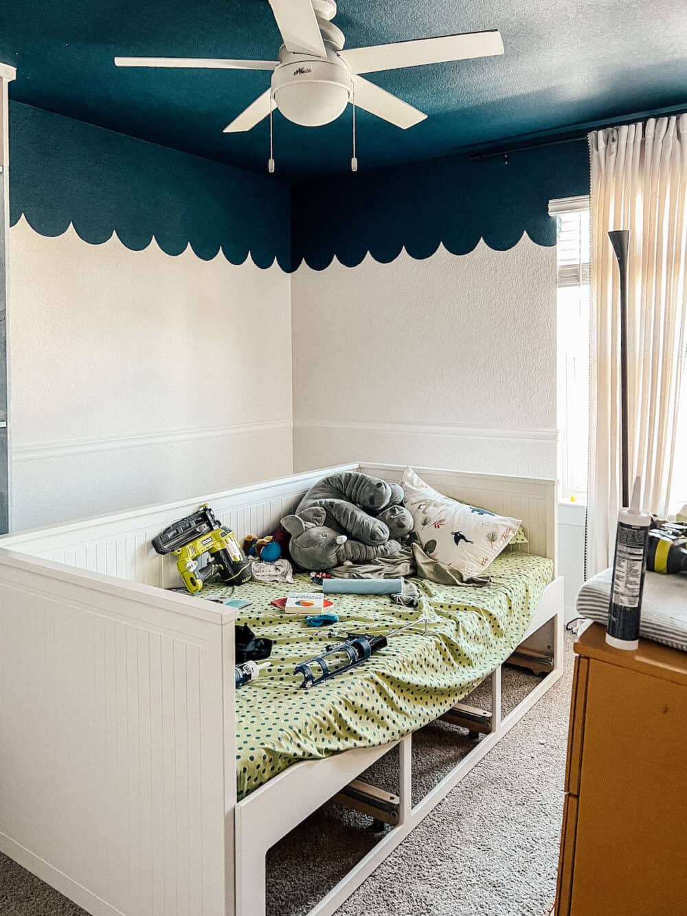 Bedroom in mid-renovation, with completed chair rail molding in the room