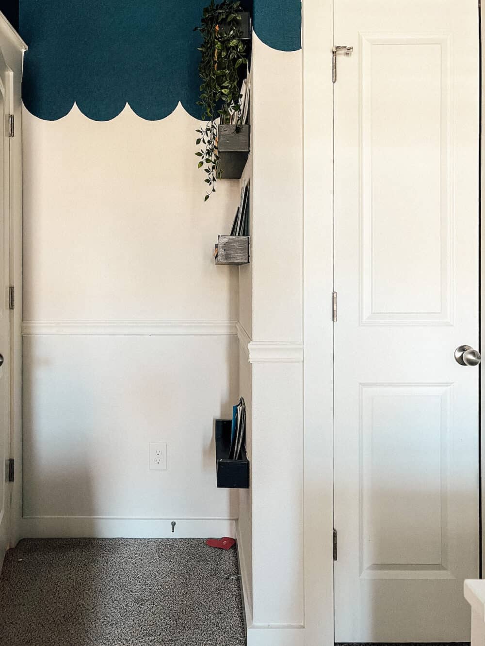 Corner of a room with white chair rail molding