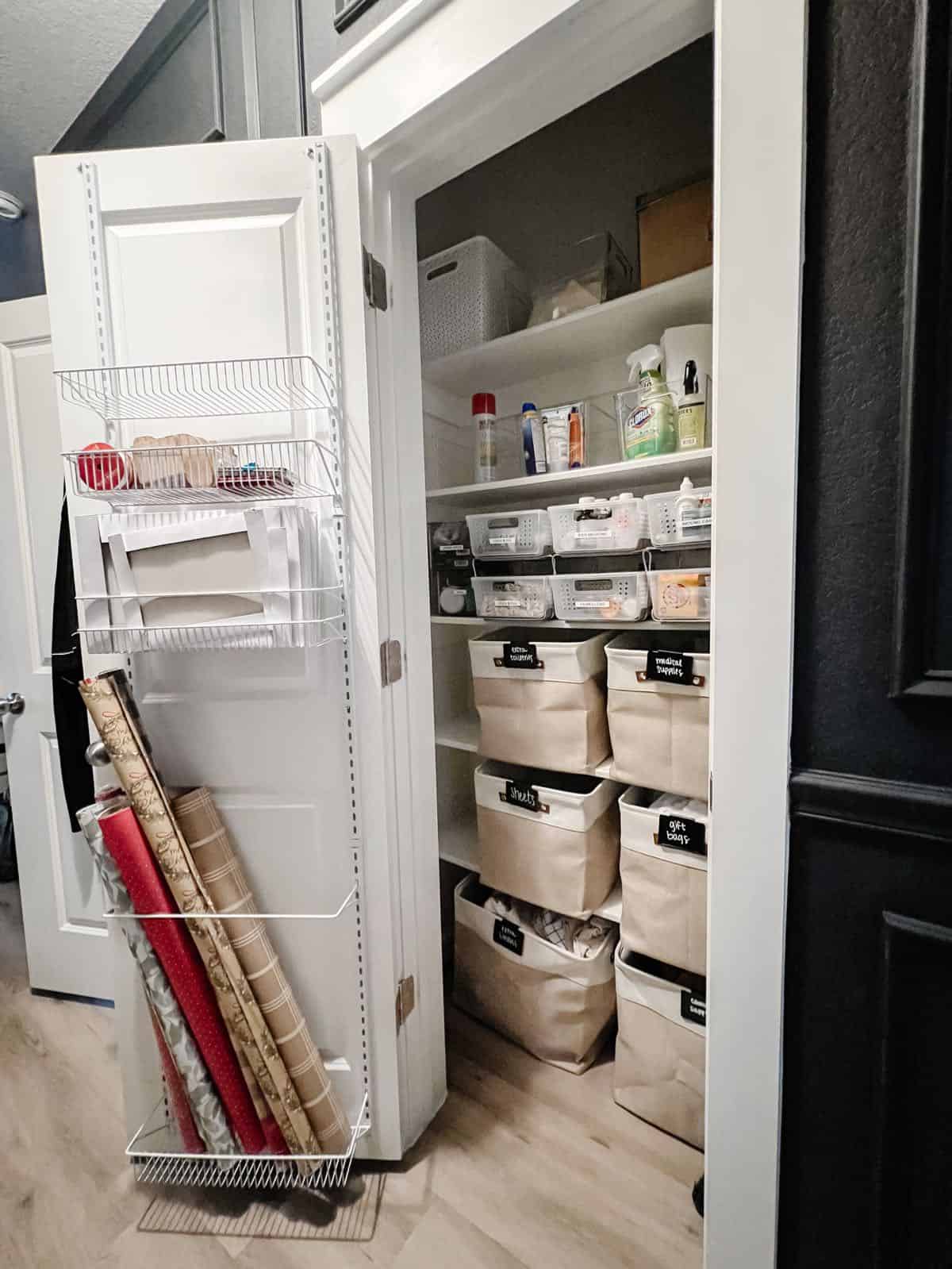 Closet with metal door organizer for gift wrap