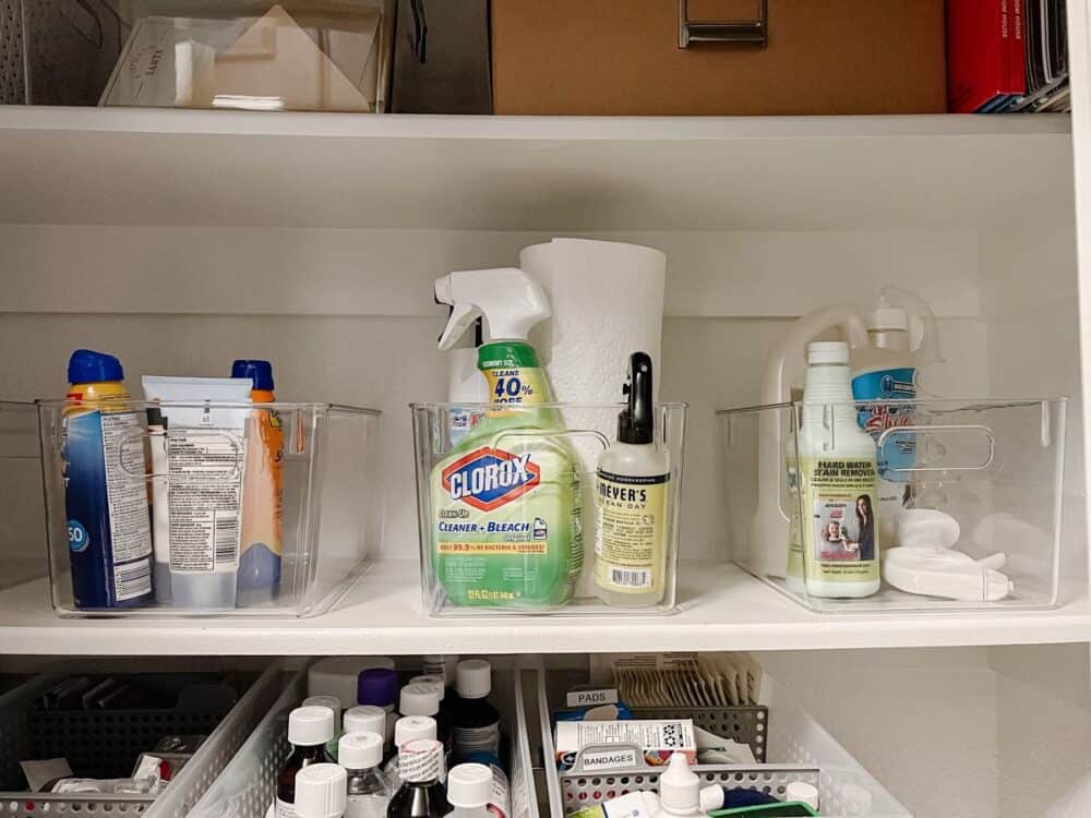 cleaning caddies in a linen closet 