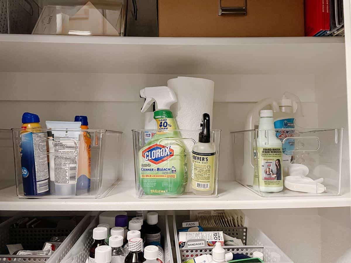cleaning caddies in a linen closet