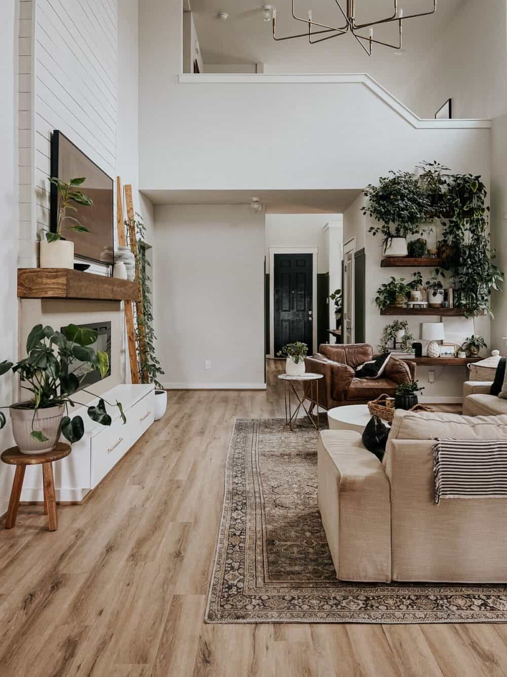 living room with a Frame TV hung above the fireplace 