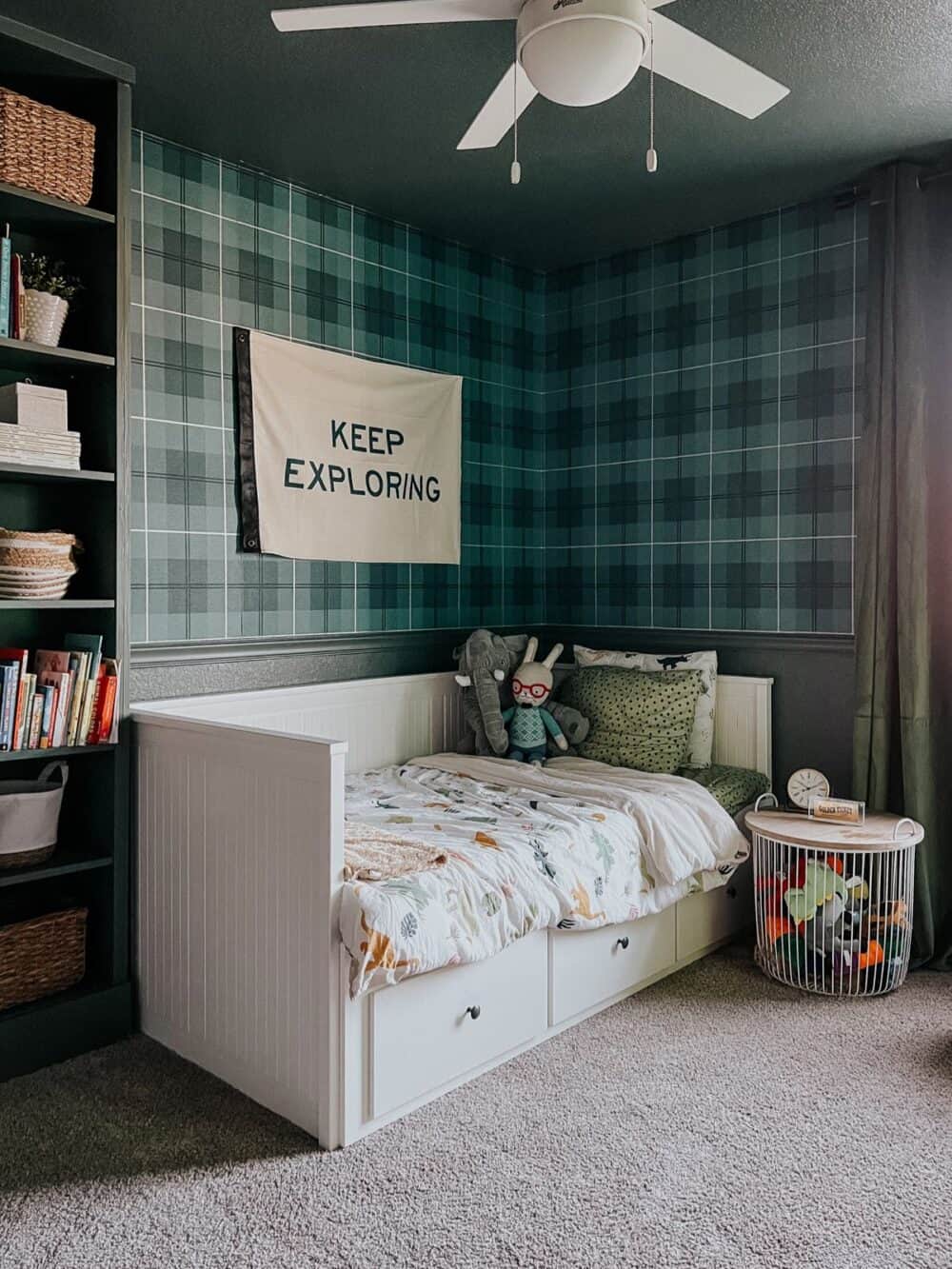 a young boy's bedroom with a storage bed and a table that holds stuffed animals