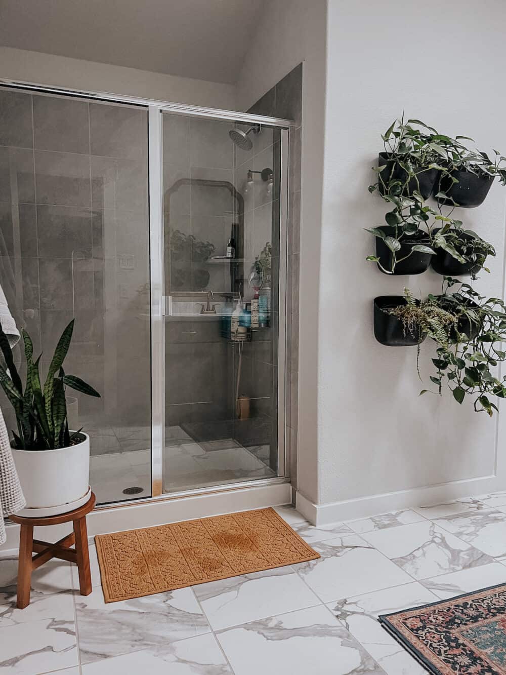 Bathroom with lots of plants 