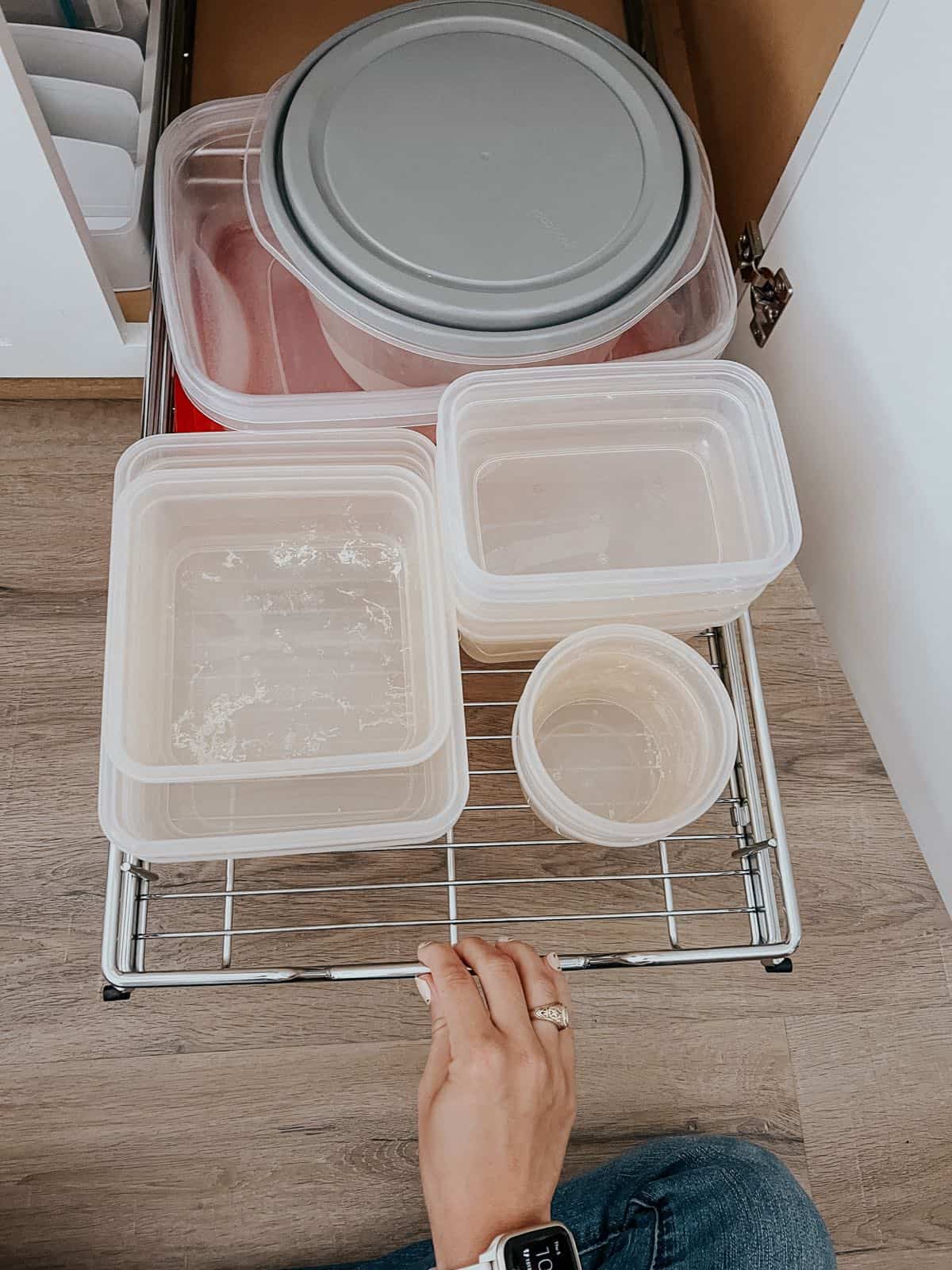 Cabinet pull-out shelf with food storage containers