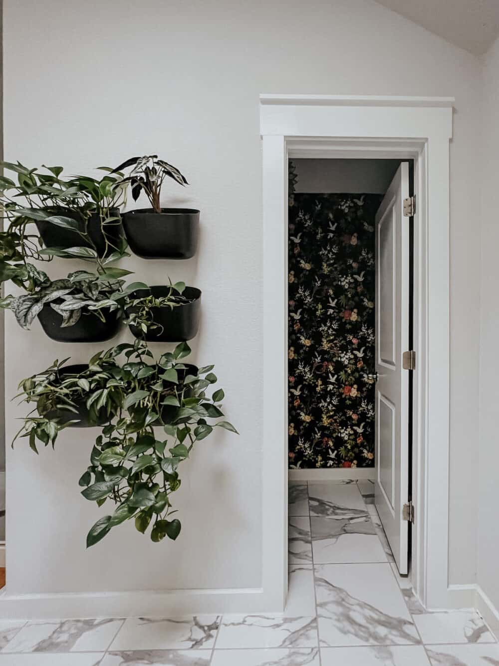 Bathroom with a bold wallpapered water closet 