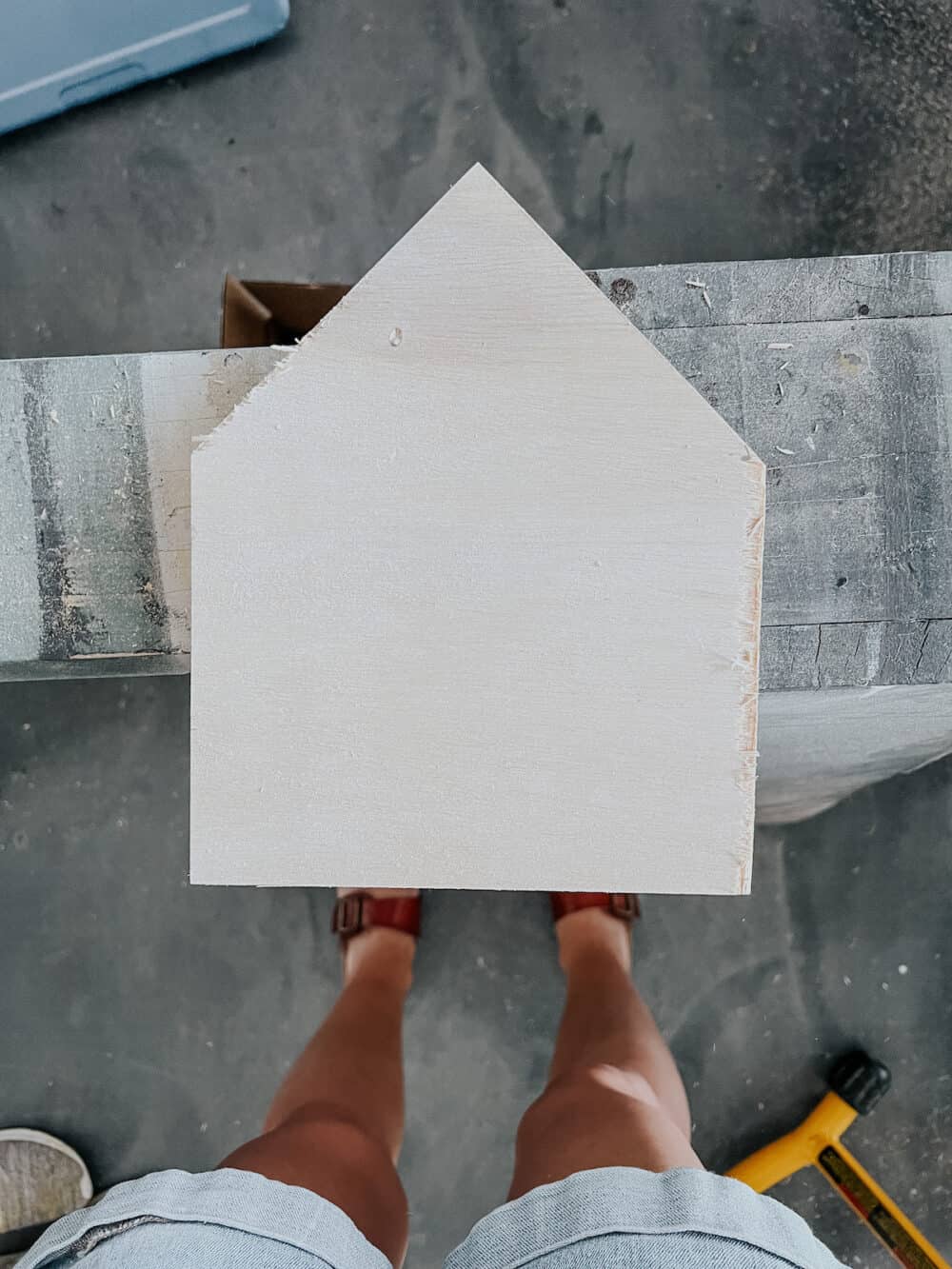 Piece of plywood shaped like a house 