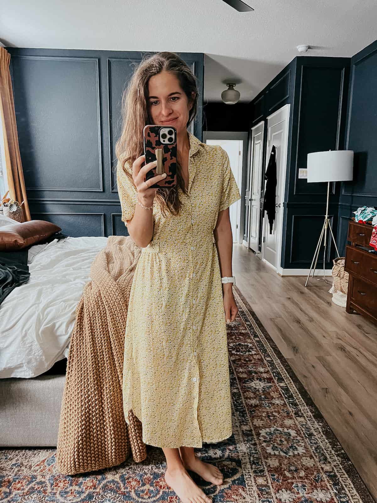 Woman in a button down yellow floral dress