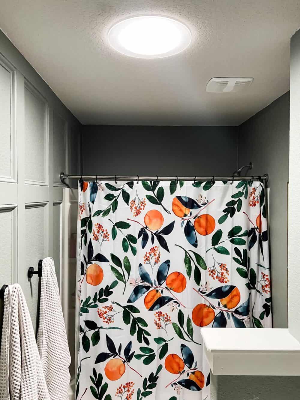 close up image of velux sun tunnel in a small bathroom
