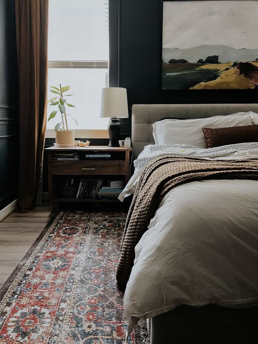 Bedroom with a white bed with a book on top