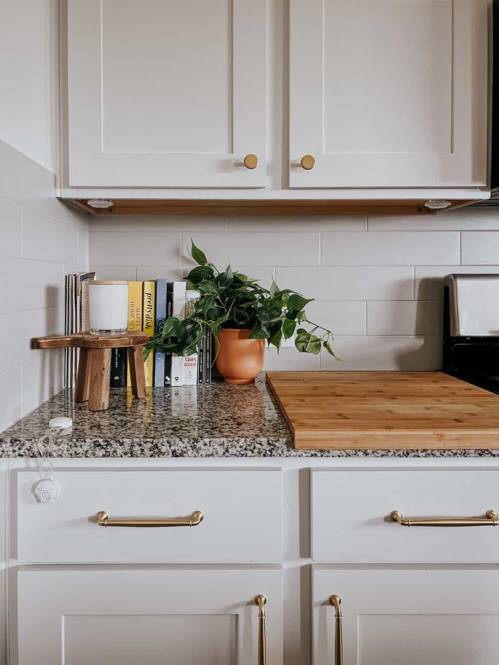 corner of a kitchen styled with cookbooks