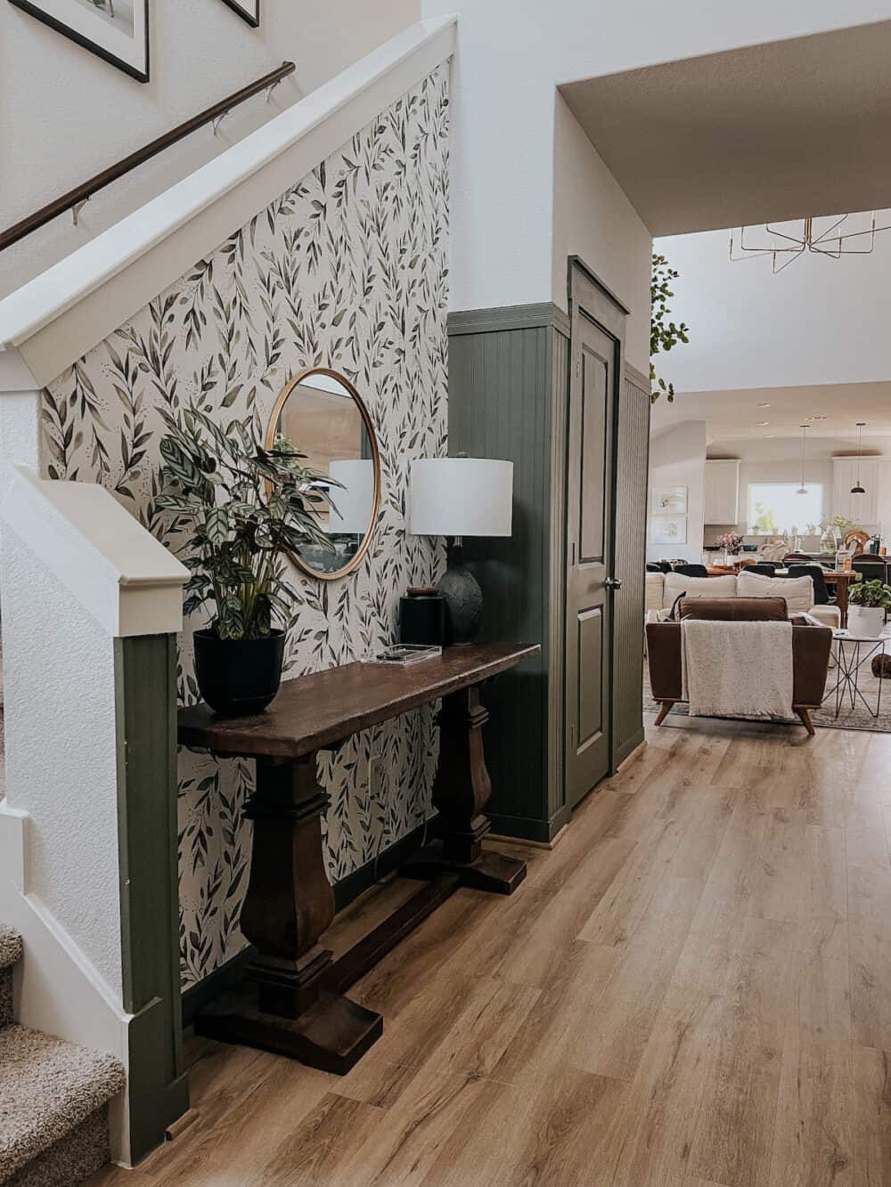 Entry with wallpaper and green beadboard and trim