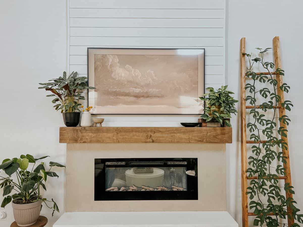 Electric fireplace with a Samsung Frame TV hanging above it
