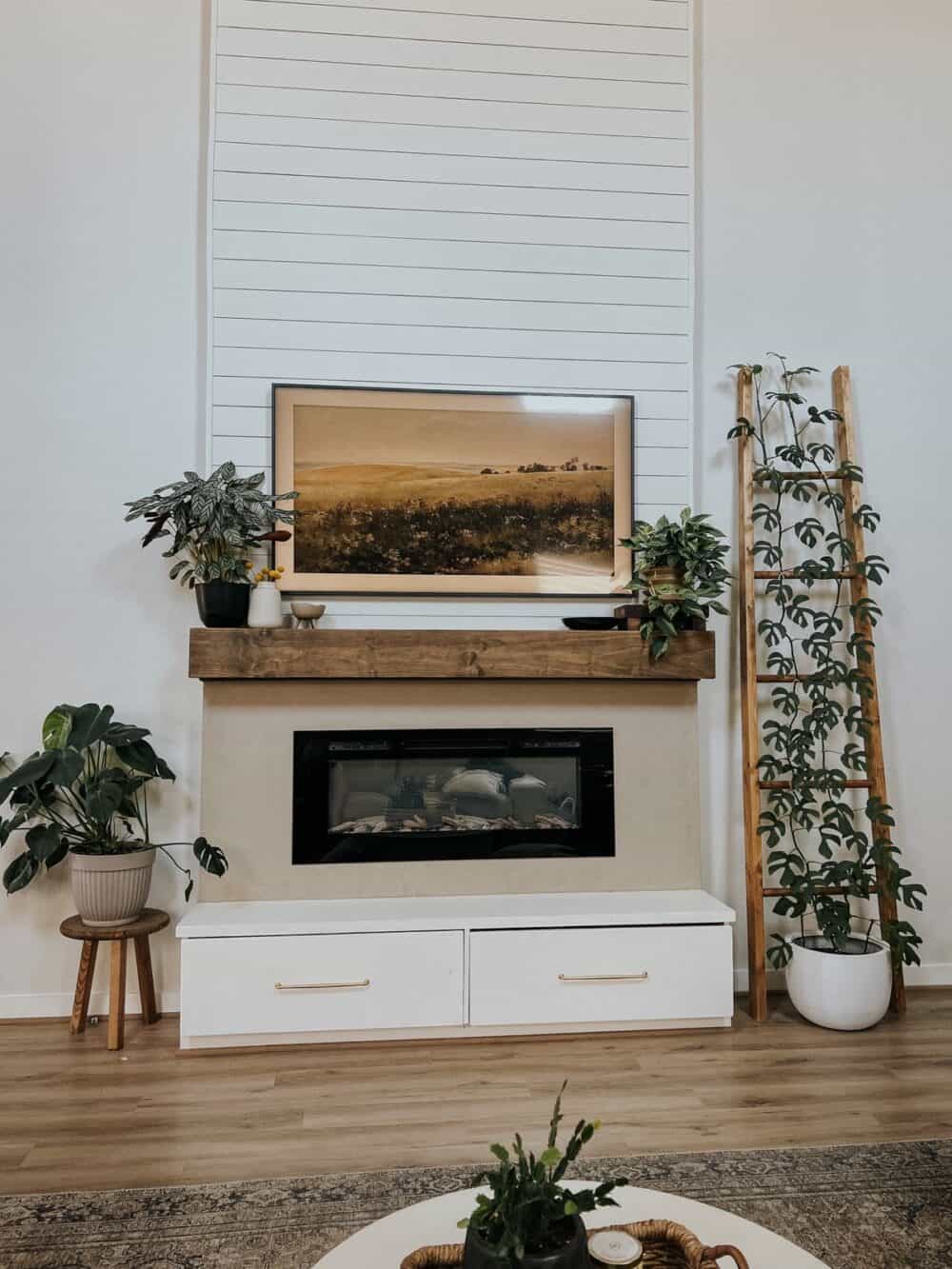 living room with a tall fireplace 