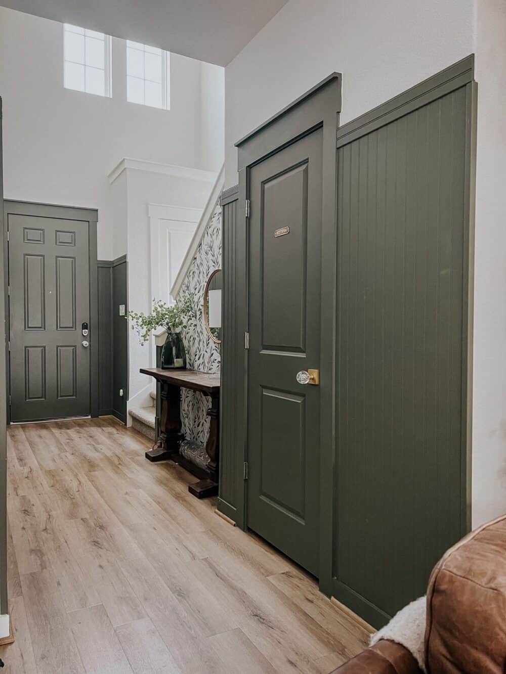 Entry way with green paneling 