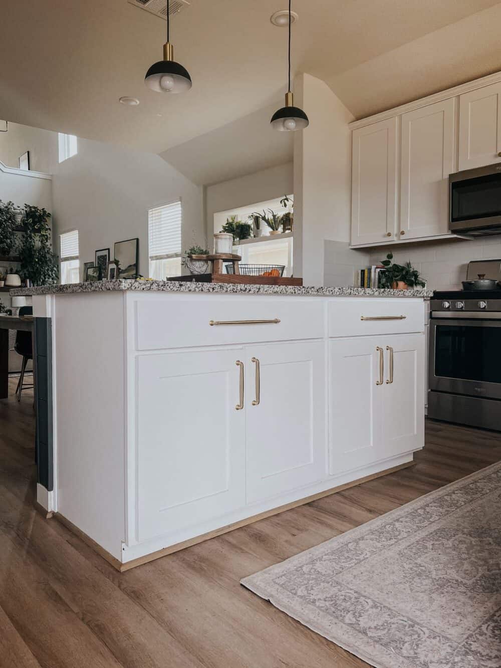 white kitchen island prior to painting it black 