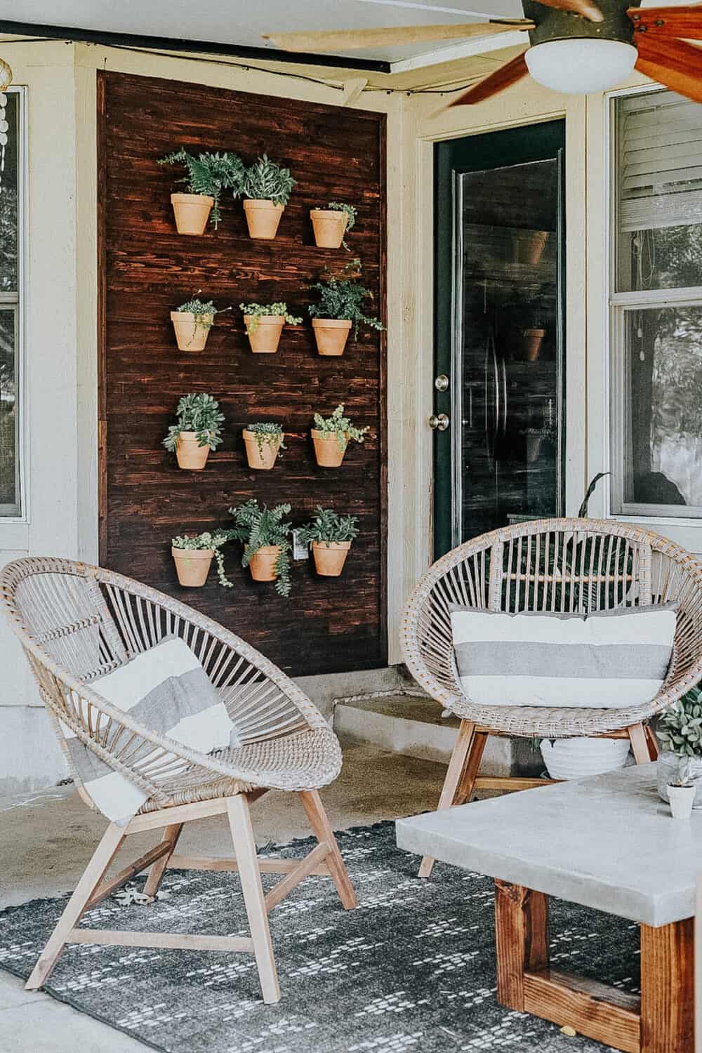 Outdoor plant wall with plants attached to a wood wall