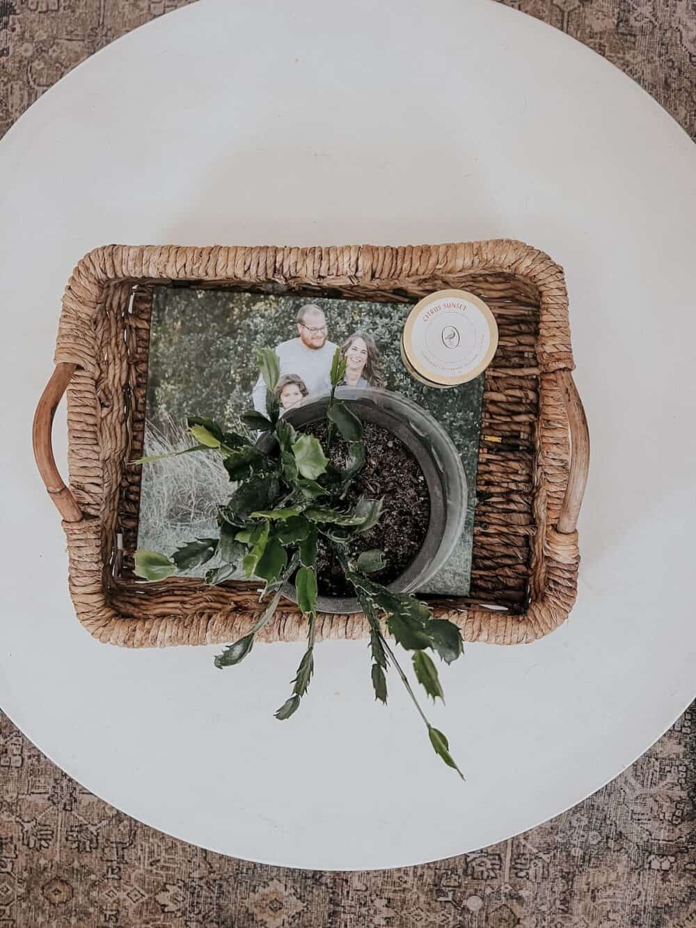 Coffee table with a wicker tray and a family photo album