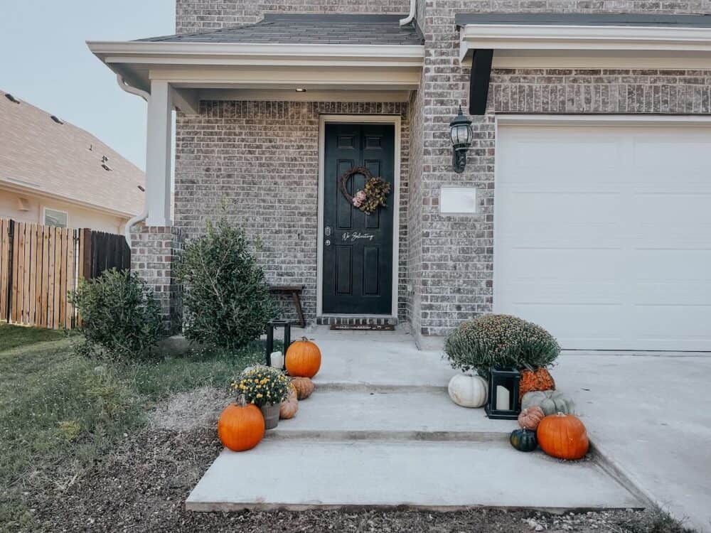 front yard with concrete steps leading to the front porch 