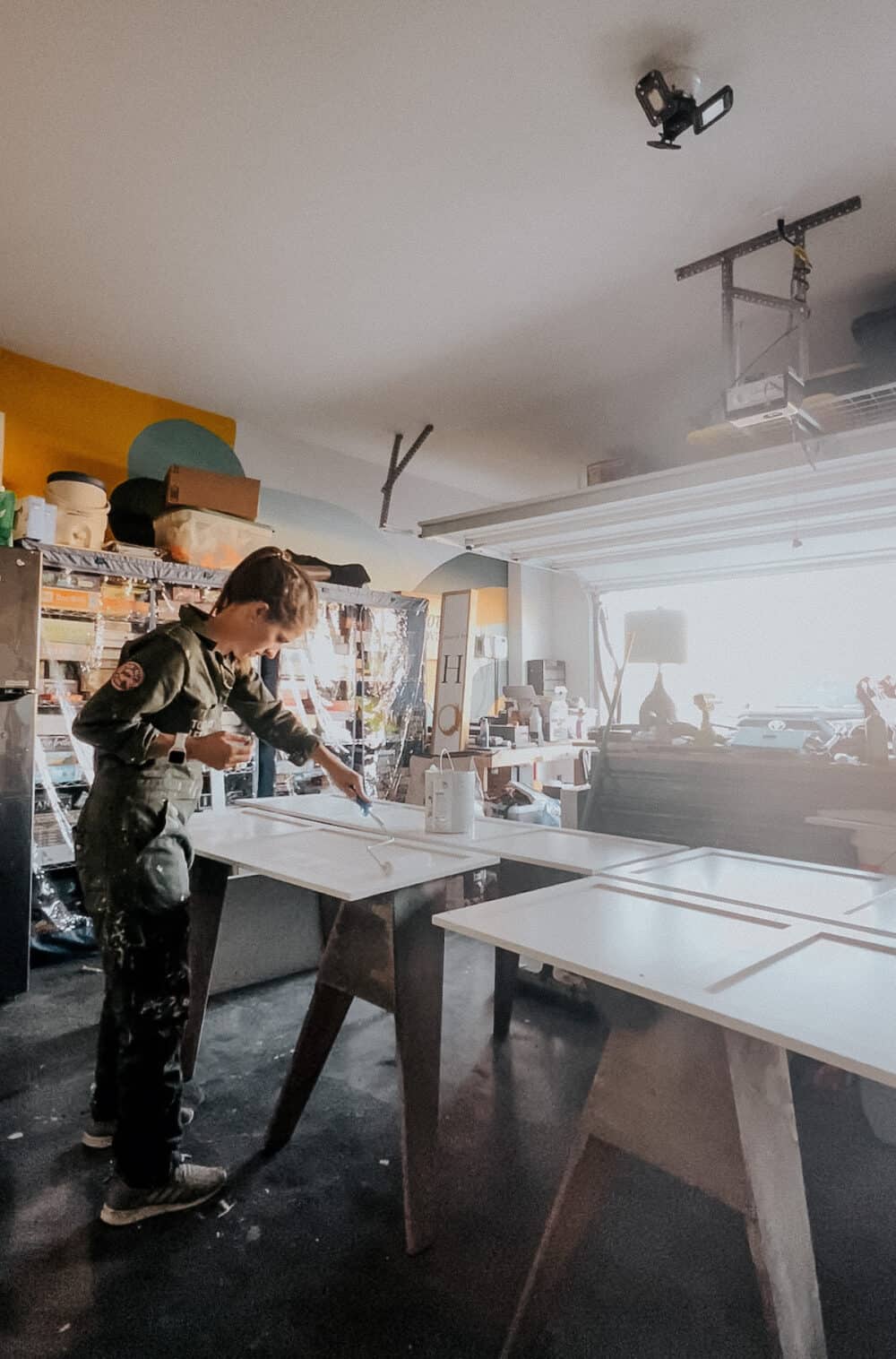 woman priming a cabinet 