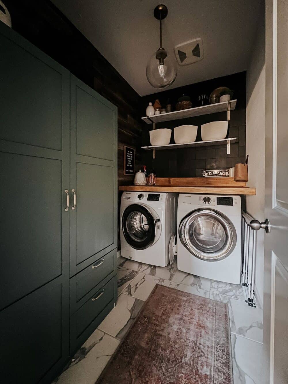 Laundry room with a large green storage cabinet 