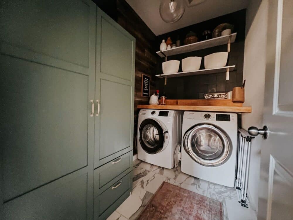 laundry room with a tiled wall