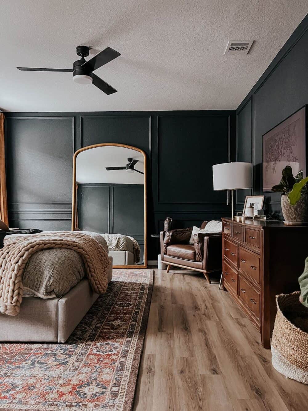 bedroom with picture frame molding on the walls 