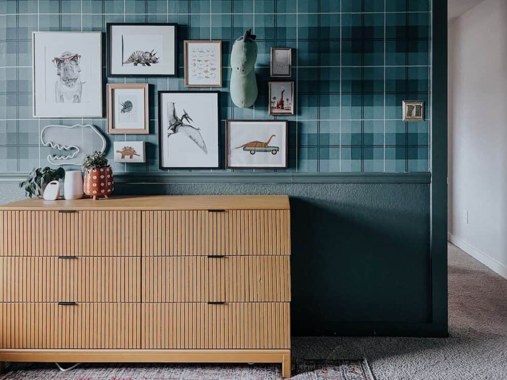 Child's bedroom with plaid walls and a yellow dresser 