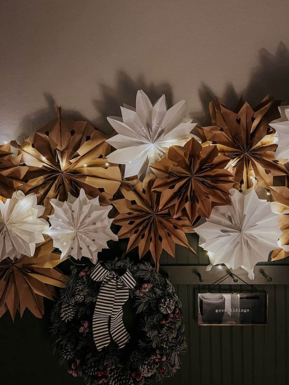 paper bag snowflake garland lit up for Christmas 