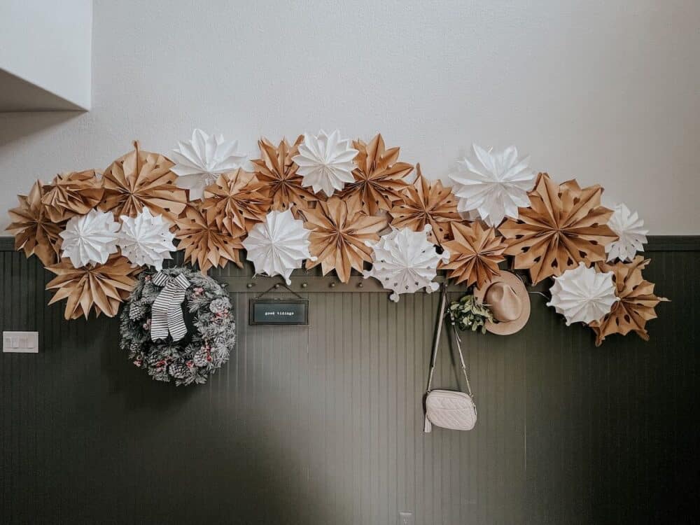 paper bag snowflake garland hanging in an entry 