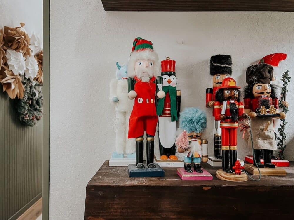 collection of nutcrackers on a shelf 
