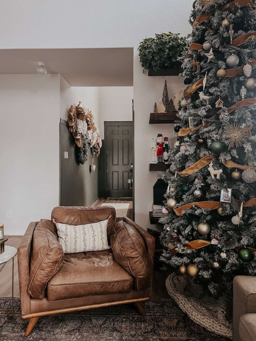 living room with a tall christmas tree 