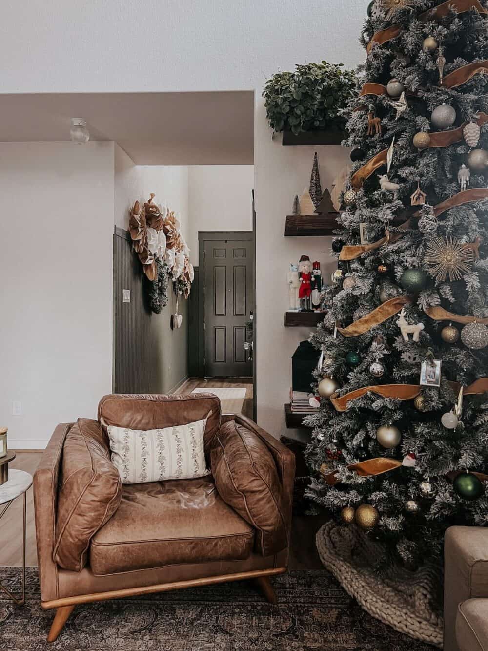 living room with a tall christmas tree