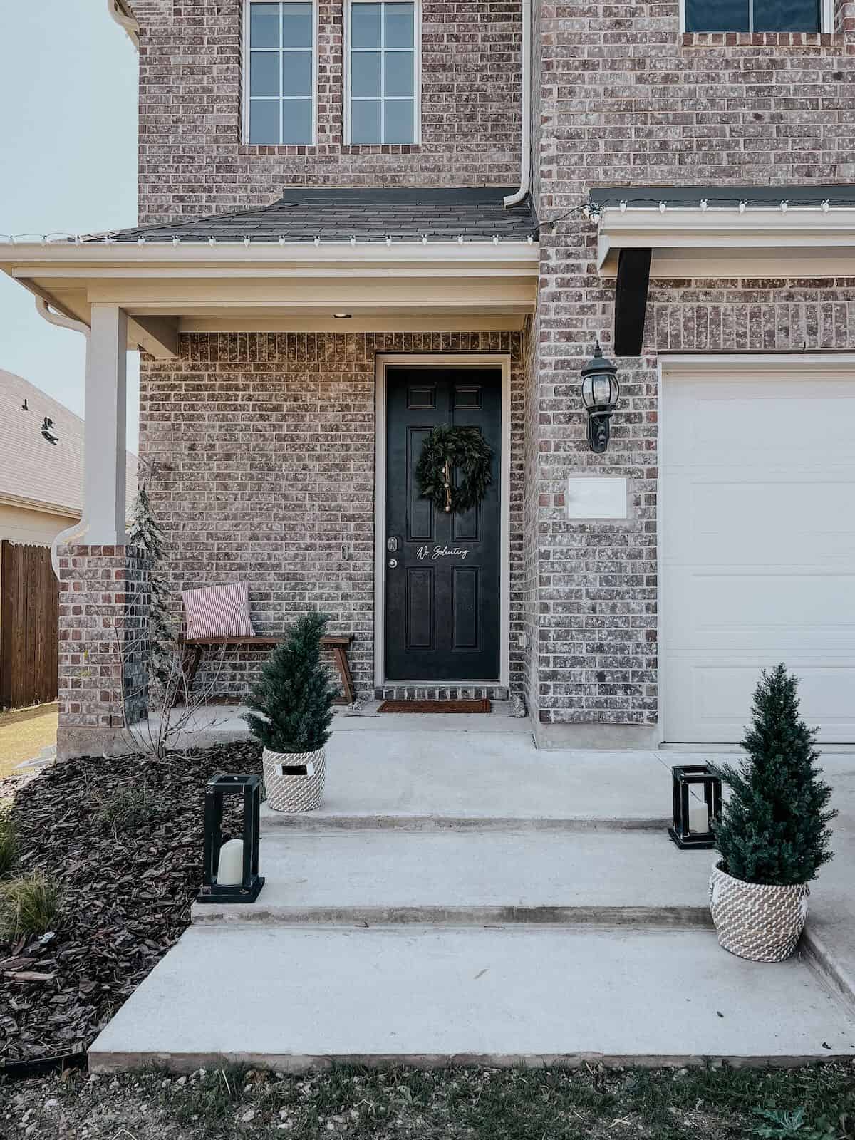 front entry of home with concrete front porch steps