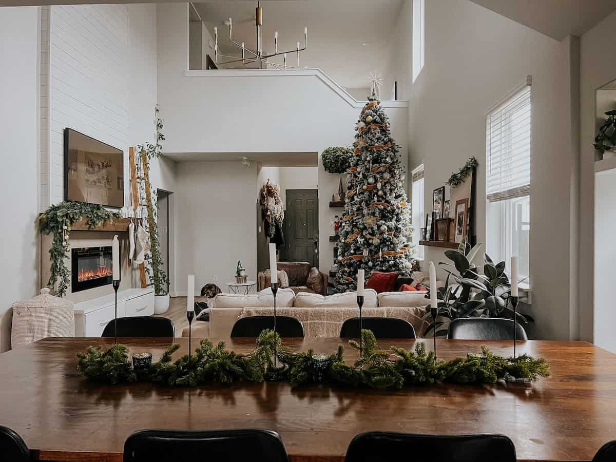 Dining room table set with garland and candlesticks