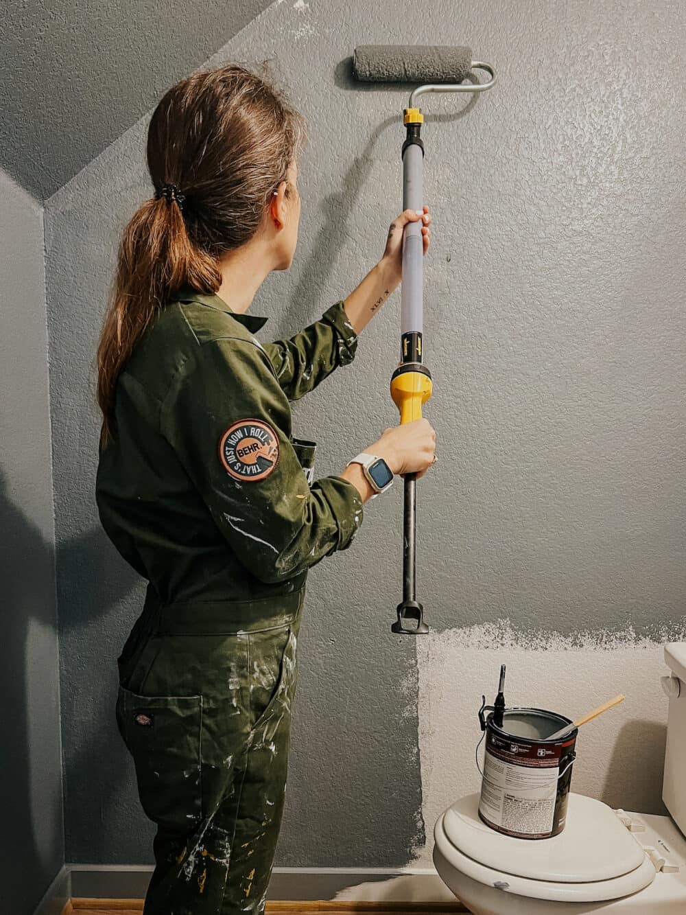 woman painting walls using an EZ roller from wagner