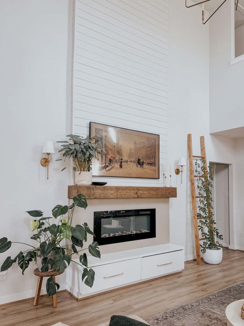 Living room fireplace wall with sconces 