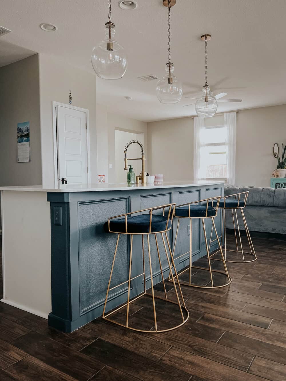 blue kitchen island with DIY trim treatment 