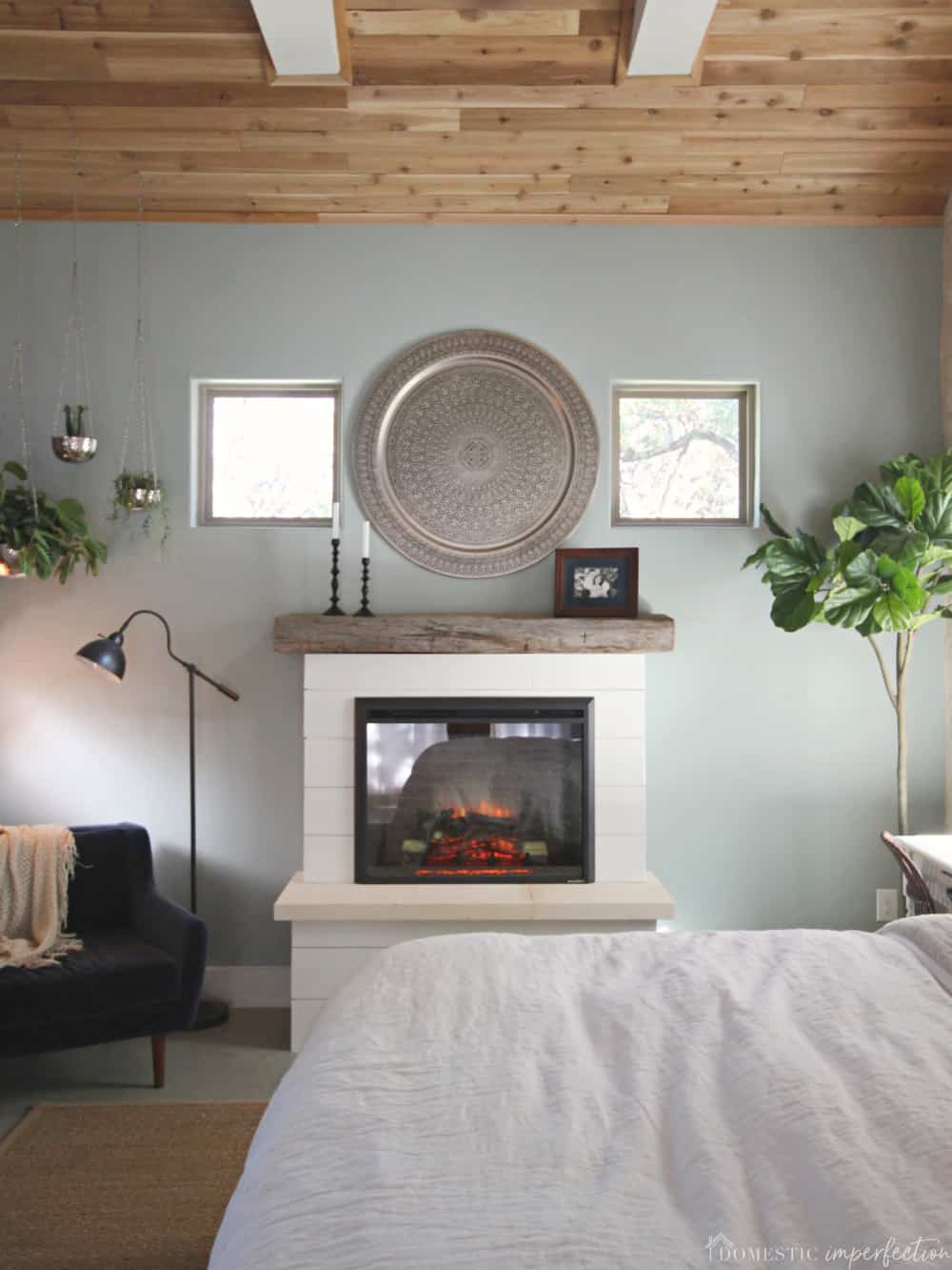 bedroom with a DIY shiplap fireplace 