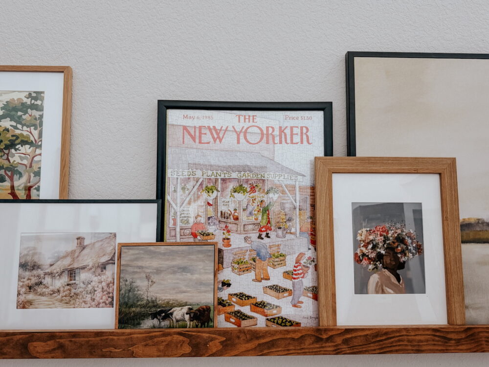 framed jigsaw puzzle sitting on a photo ledge