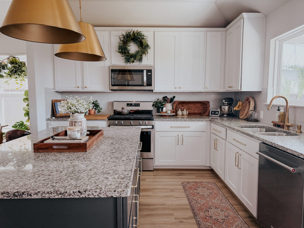 kitchen with white cabinets and a black kitchen island